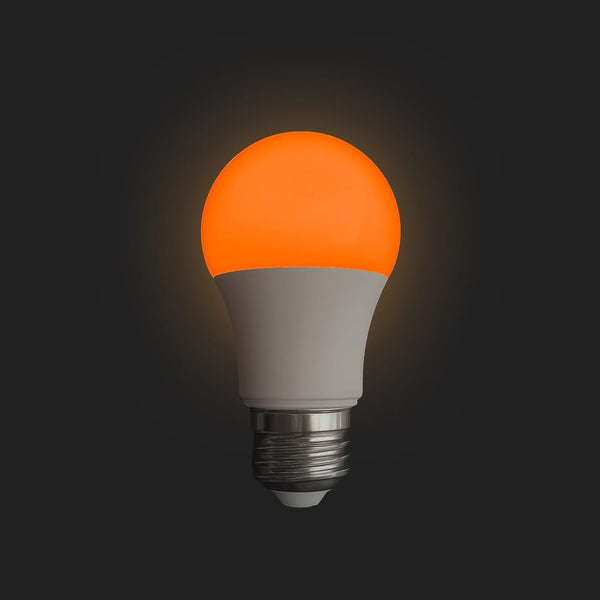 A Lumios circadian bulb glowing warm orange
