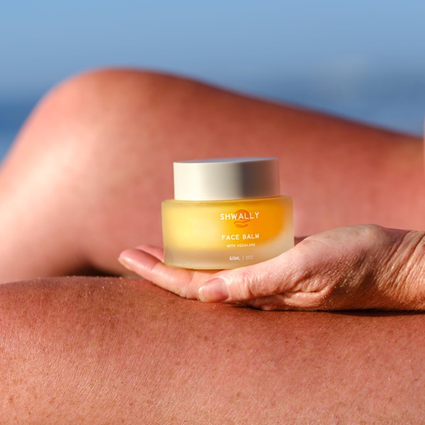 Shwally tallow balm held outdoors
